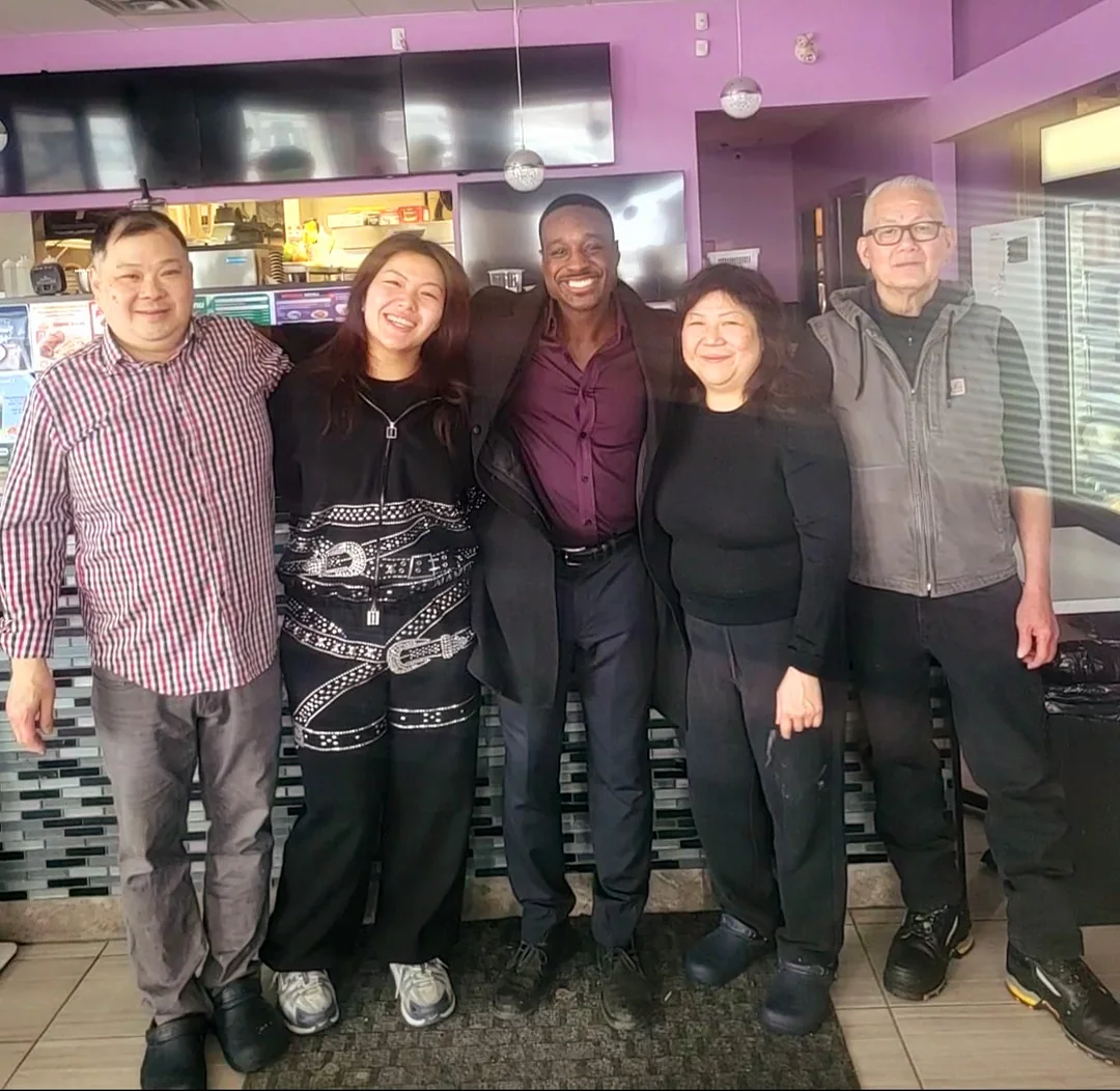 Jay Hayles with a family at a local Ajax restaurant