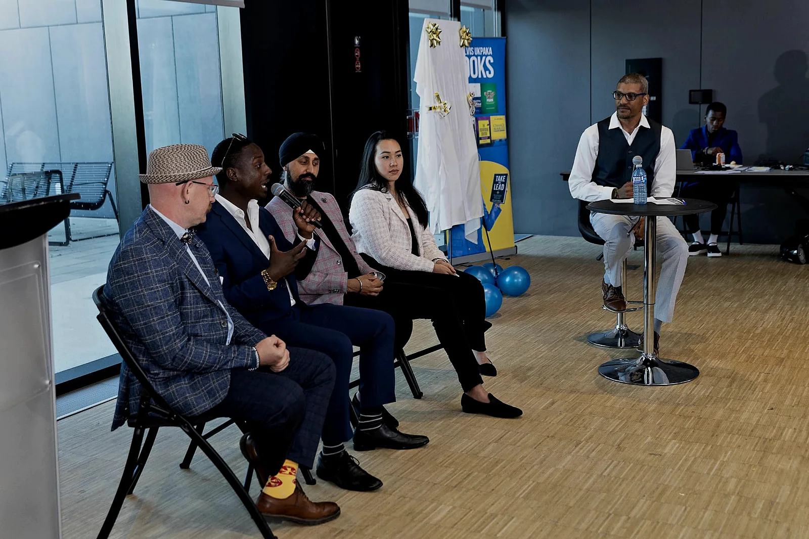Jay Hayles on a panel with community members at an Ajax event